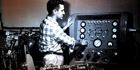 Man adjusting controls for a rocket engine